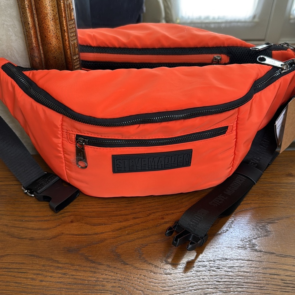 Steve Madden orange bplazza waist sling. Front & back outside zipper pouch.